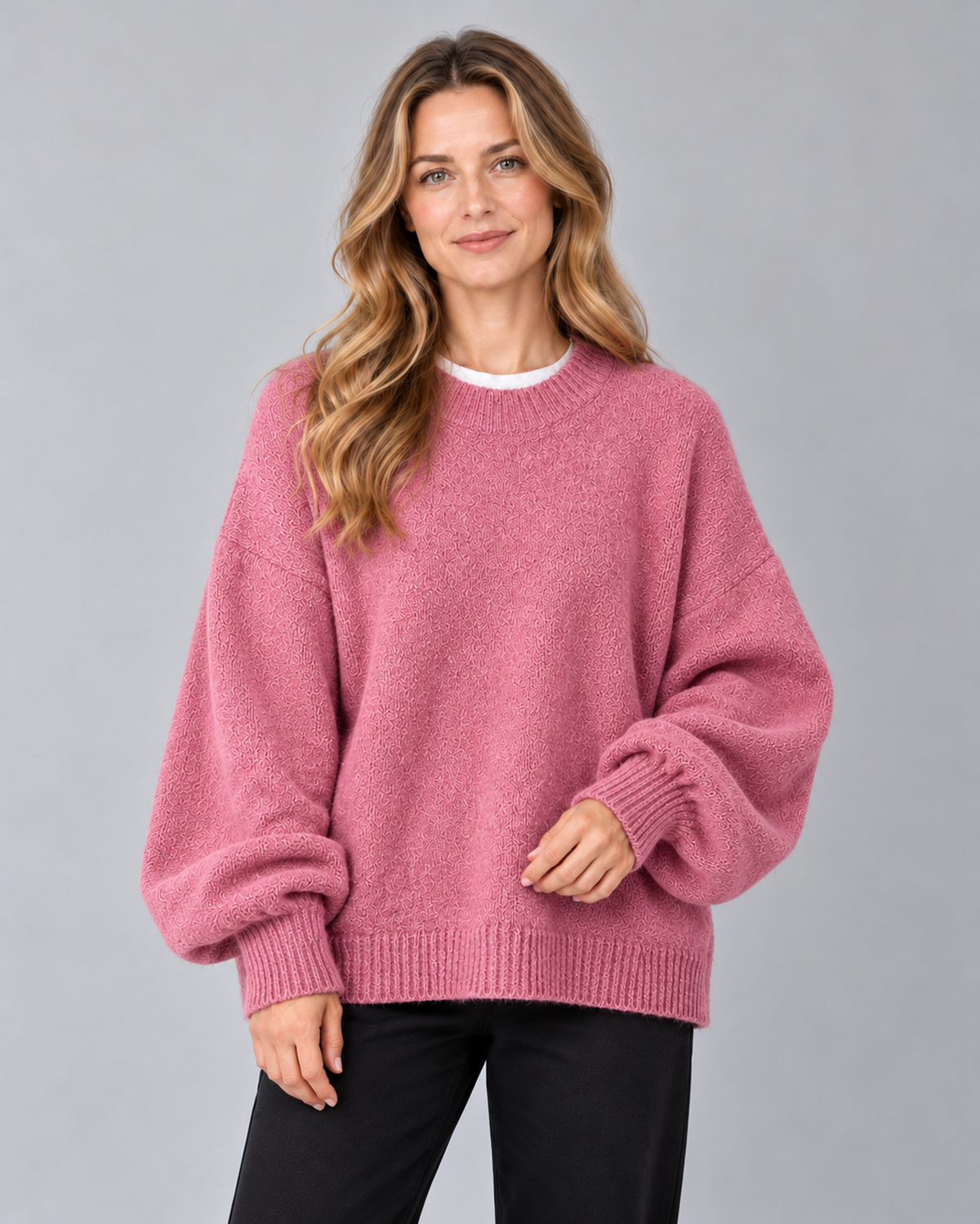 Women's round neck drop shoulder split hem jumper, pink front, studio model photograph