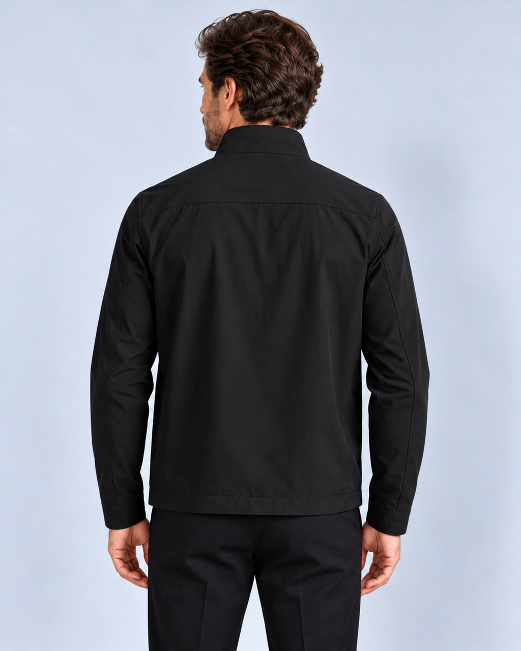 Men's premium zip-up jacket, black back view on model in light-grey studio