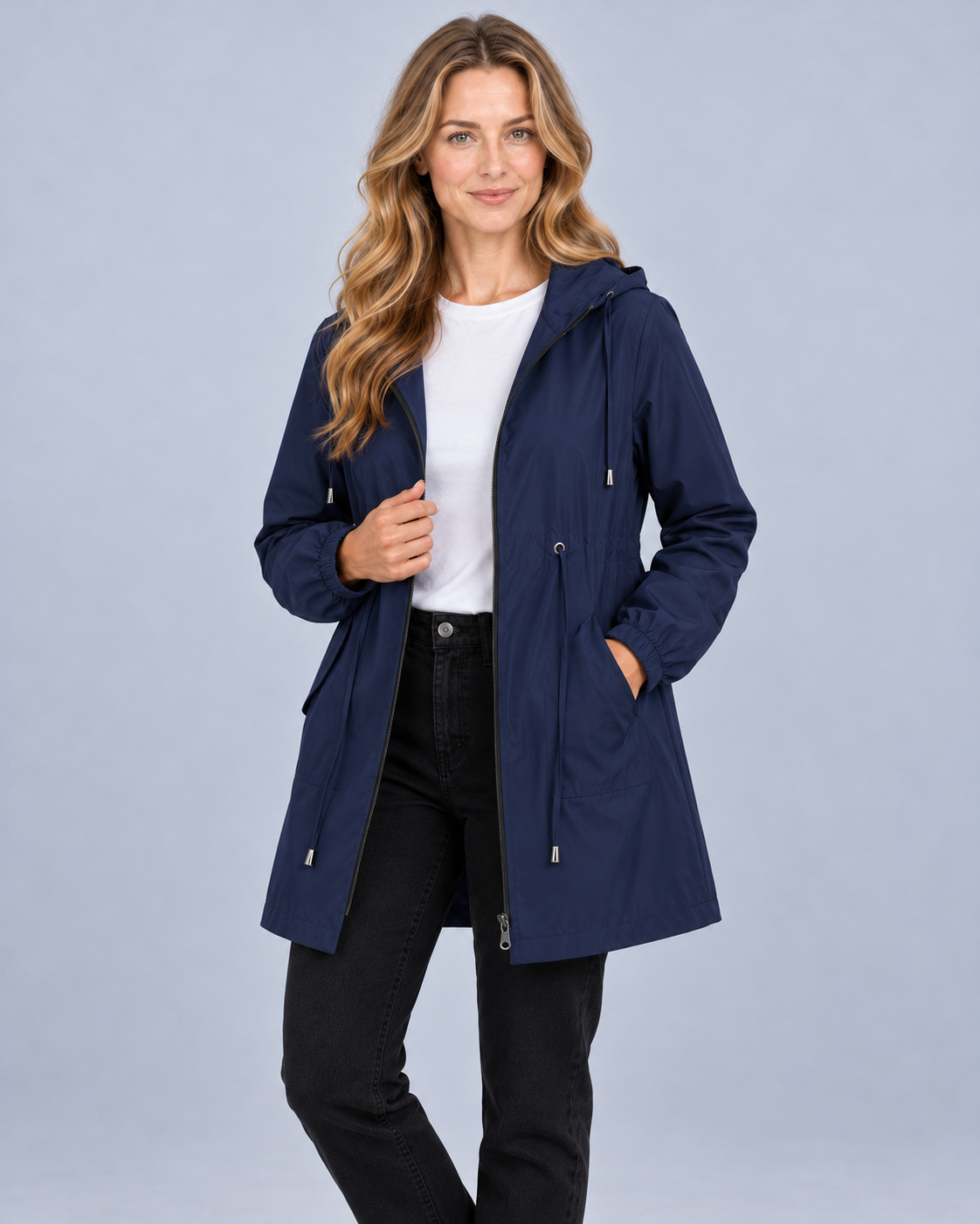 Women's lightweight hooded rain coat in navy, front view on model