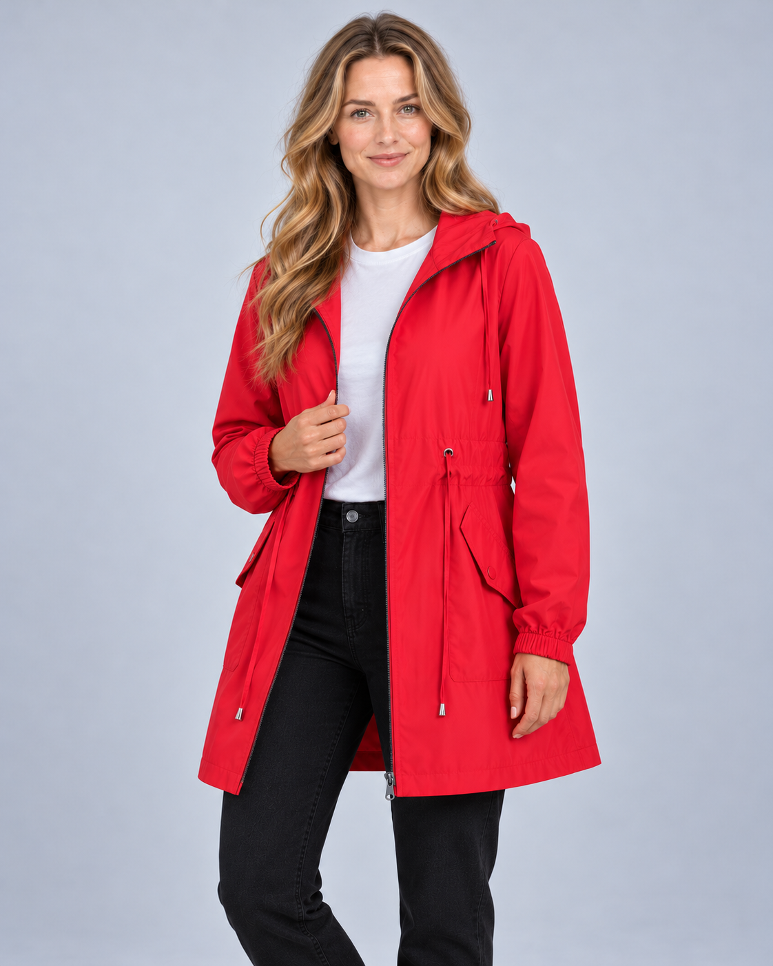 Women's lightweight hooded rain coat in red, front view on model