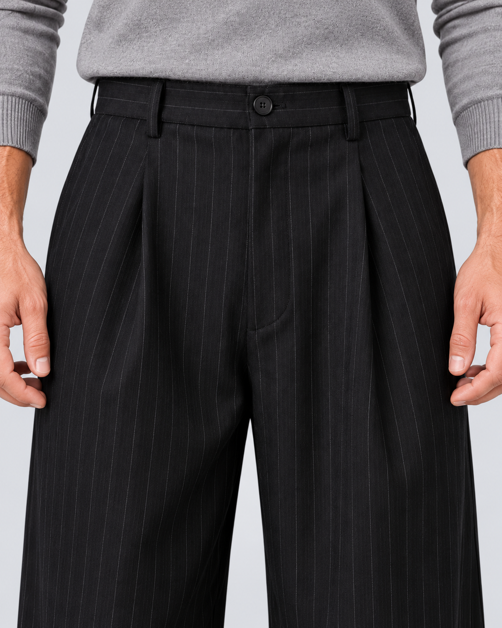 Men's black pinstripe wide-leg trousers, waist detail