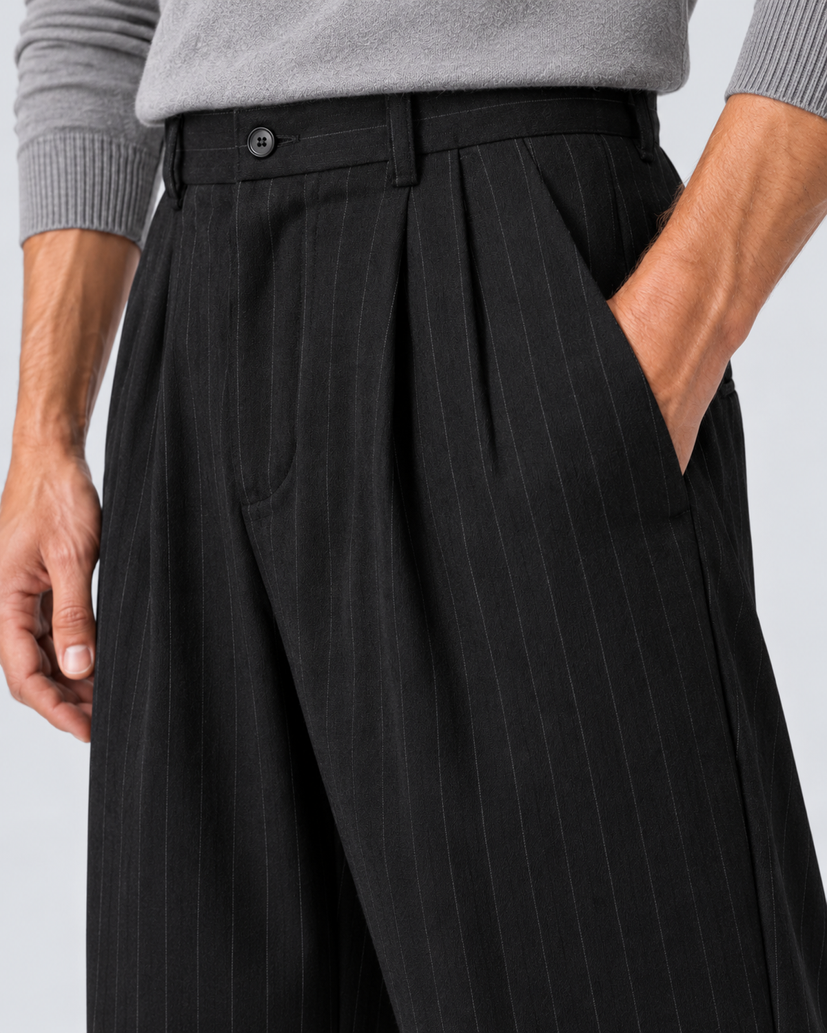 Men's black pinstripe wide-leg trousers, pocket detail