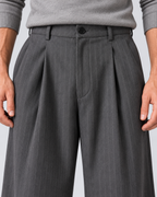 Men's grey pinstripe wide-leg trousers, waist detail