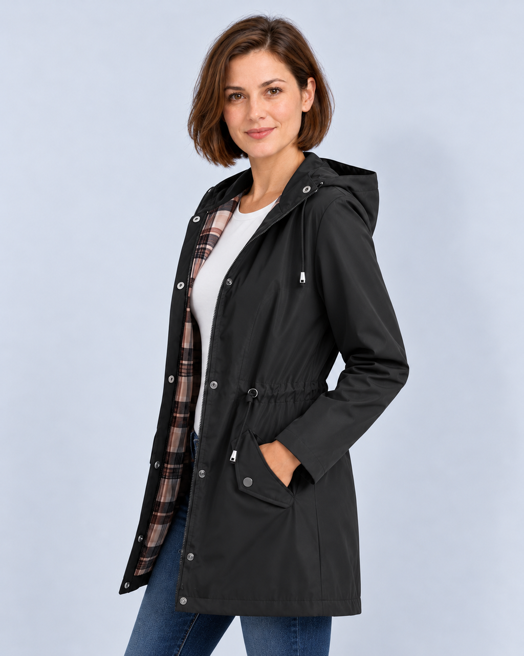 Women's black hooded check-lined raincoat, side view