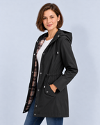 Women's black hooded check-lined raincoat, side view