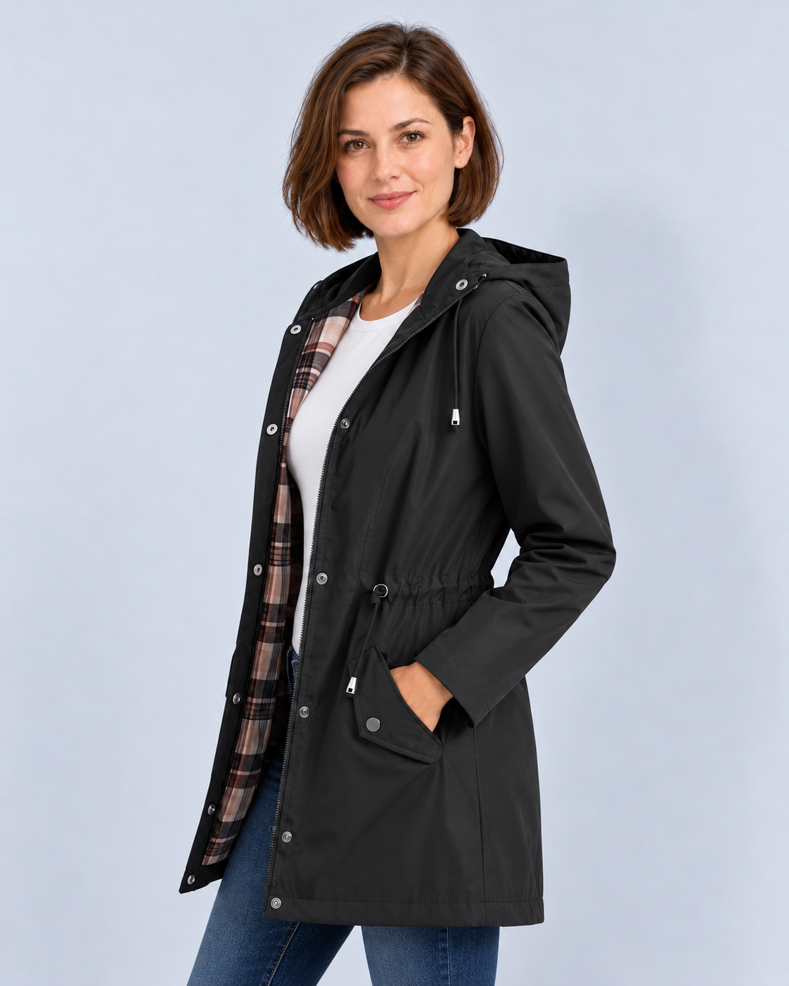 Women's black hooded check-lined raincoat, side view