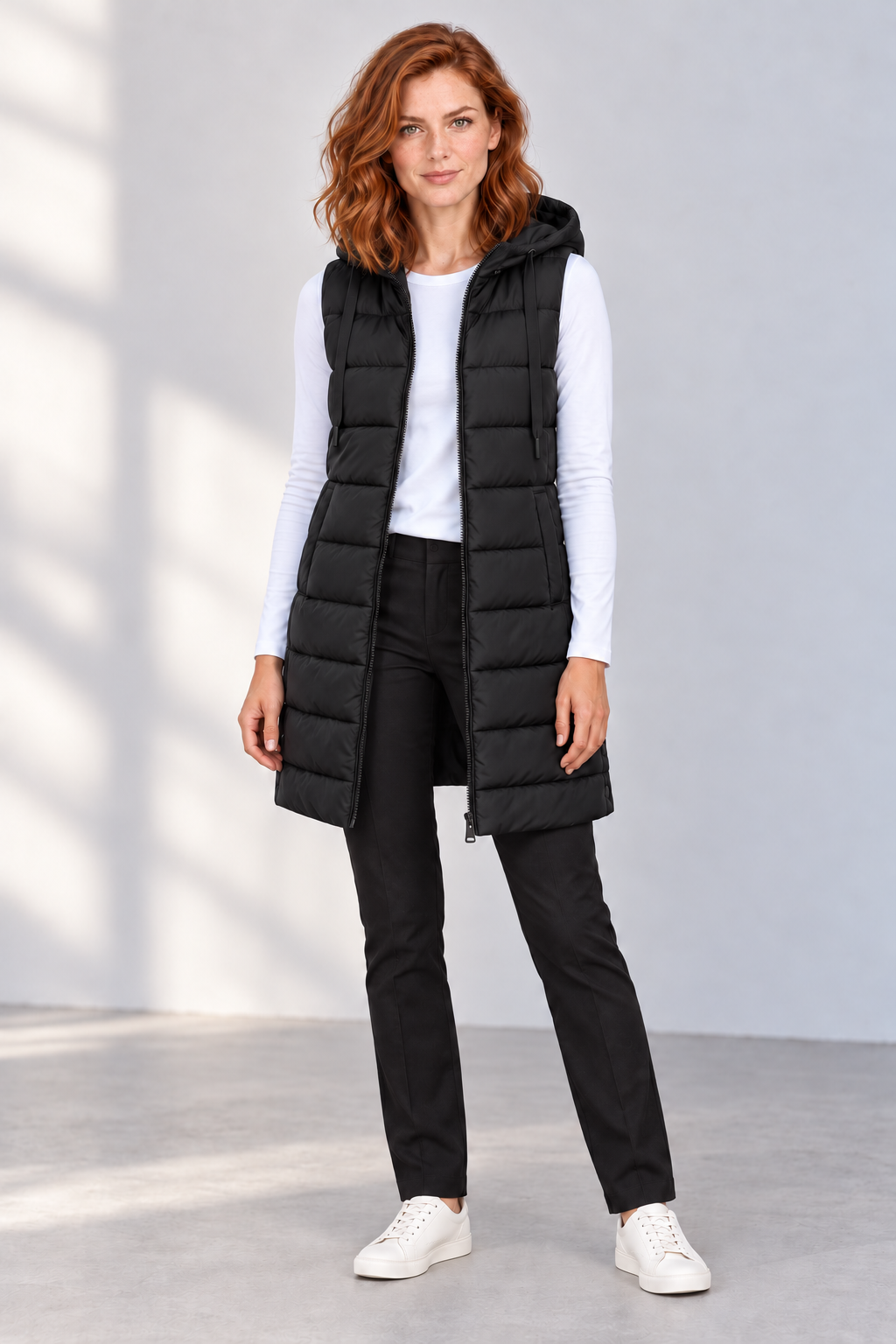Women's Longline Hooded Zip-Up Puffer Vest in Black, front view