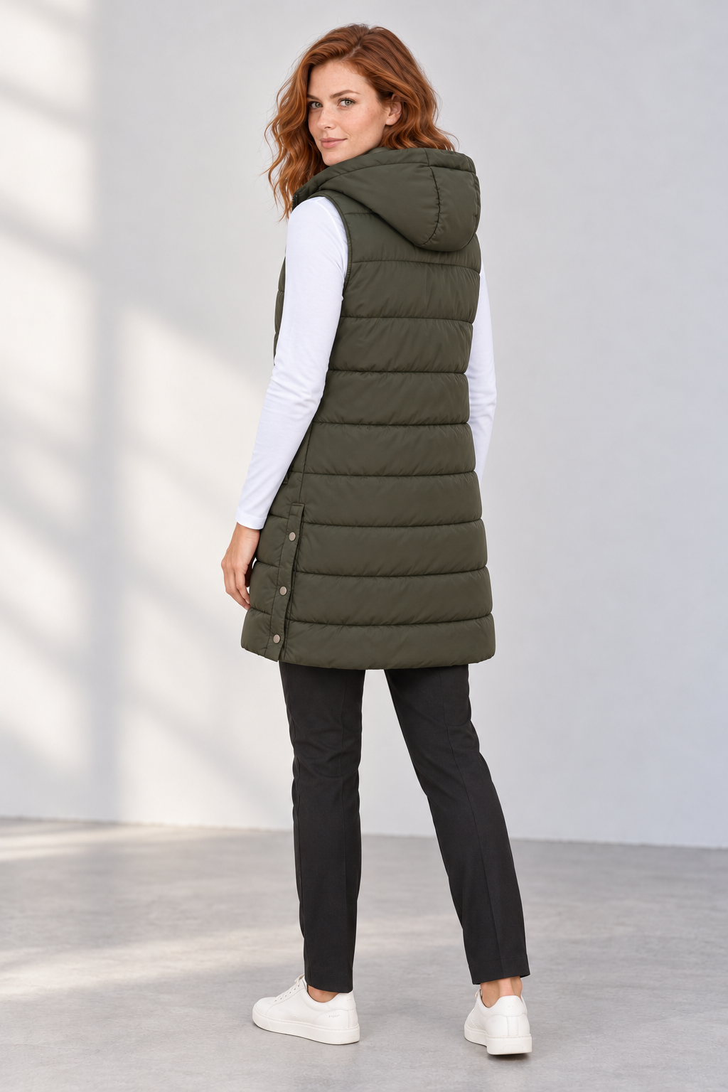 Women's Longline Hooded Zip-Up Puffer Vest in Dark Green Rear view