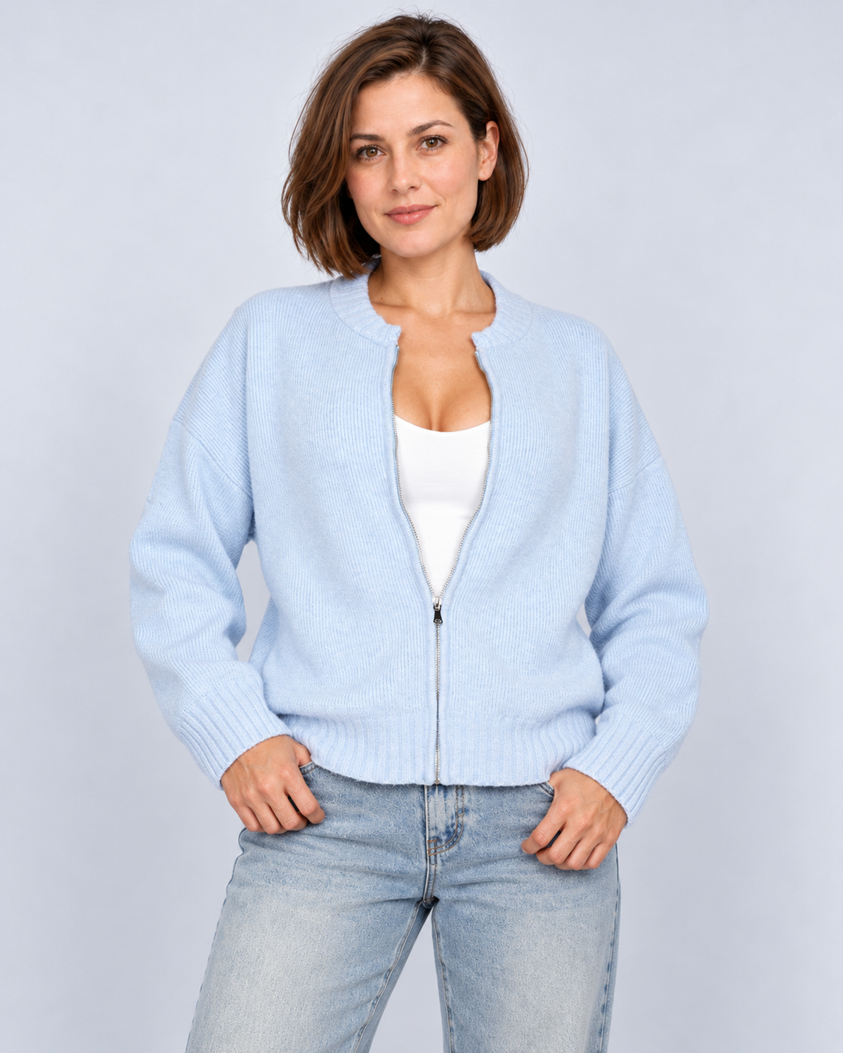 Women's drop-shoulder zip-front knit cardigan in blue, front studio view